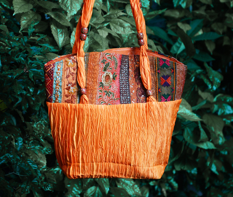 Vogue Crafts & Designs Pvt. Ltd. manufactures Crinkled Satin Bag at wholesale price.