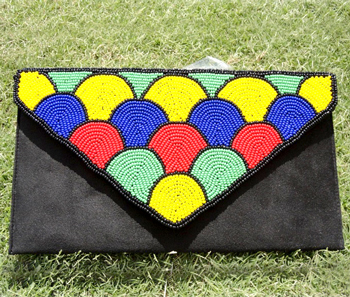 Vogue Crafts & Designs Pvt. Ltd. manufactures Multi-colored Beads Clutch at wholesale price.