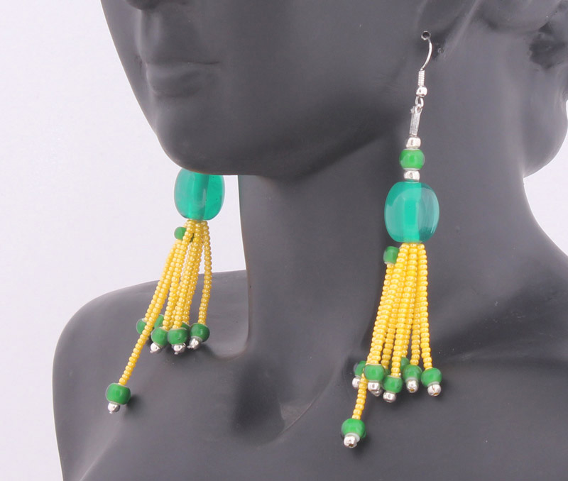 Vogue Crafts & Designs Pvt. Ltd. manufactures Tails of Yellow Earrings at wholesale price.