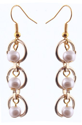 Vogue Crafts and Designs Pvt. Ltd. manufactures Trapped Pearls Earrings at wholesale price.