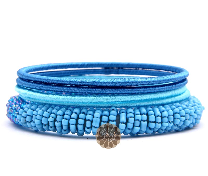 Vogue Crafts & Designs Pvt. Ltd. manufactures Blue Beaded and Silk Thread Bangles at wholesale price.
