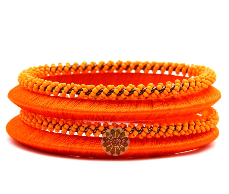 Vogue Crafts & Designs Pvt. Ltd. manufactures Beaded Orange Bangle Stack at wholesale price.