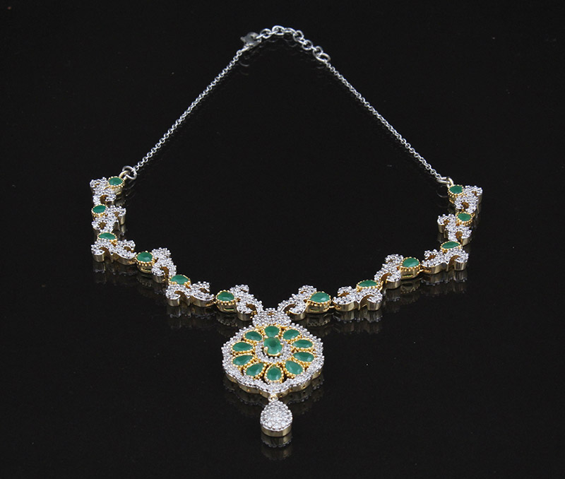 Vogue Crafts & Designs Pvt. Ltd. manufactures Emerald and Diamonds Earrings-Necklace set at wholesale price.